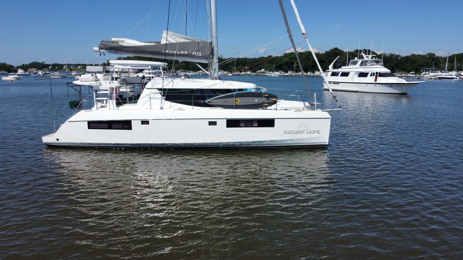 Starboard exterior with Radiant Hope name and Leopard 45 cover